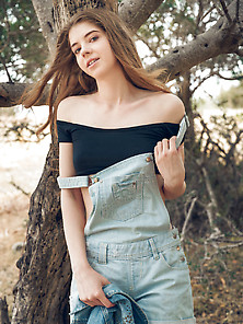 Brunette Takes Off Her Black Top And Overalls,  Climbs A Tree Na