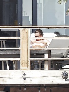 Cara Delevingne Topless Sunbathing