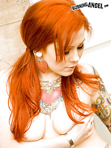 Redhead Misti Dawn strips outside
